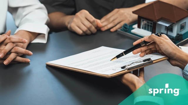 Couple looking at homeowners grant papers