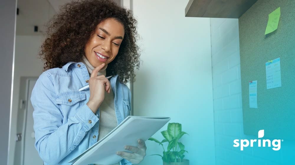 Woman filling out taxes checklist